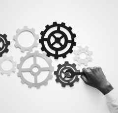 person fixing gears wall decor